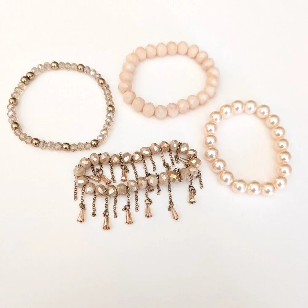 Bundle of nude and natural beaded stretch bracelets
